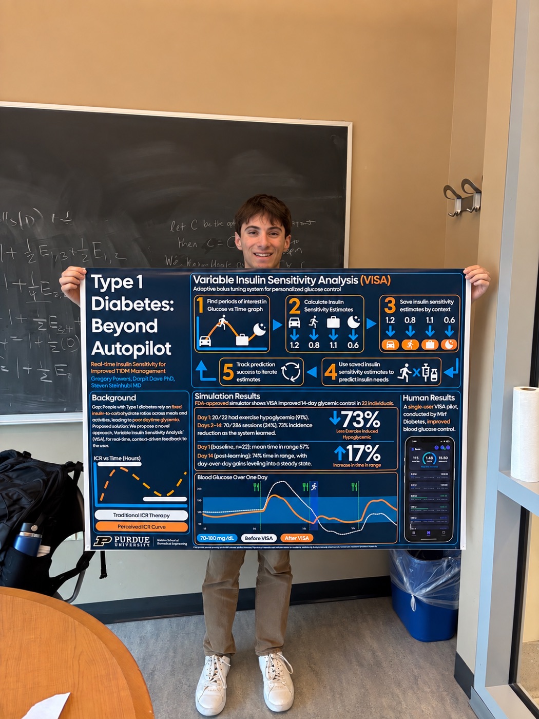 Gregory holding his type 1 diabetes research poster